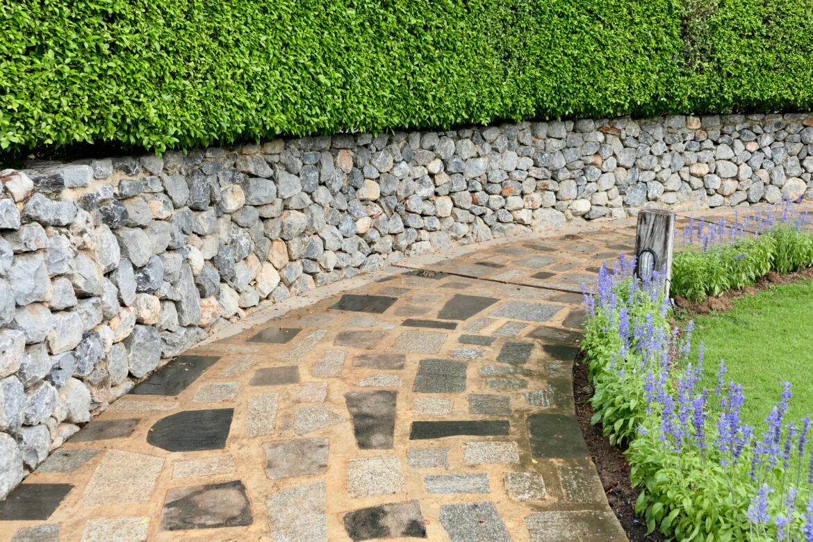 Concrete cement walkway in the garden lawn